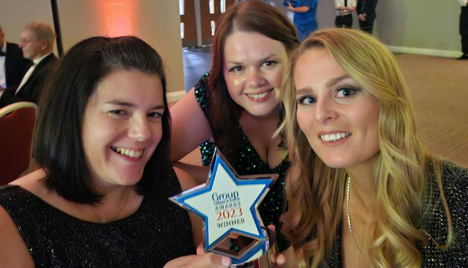 Arboretum team holding the Group Leisure and Travel Award