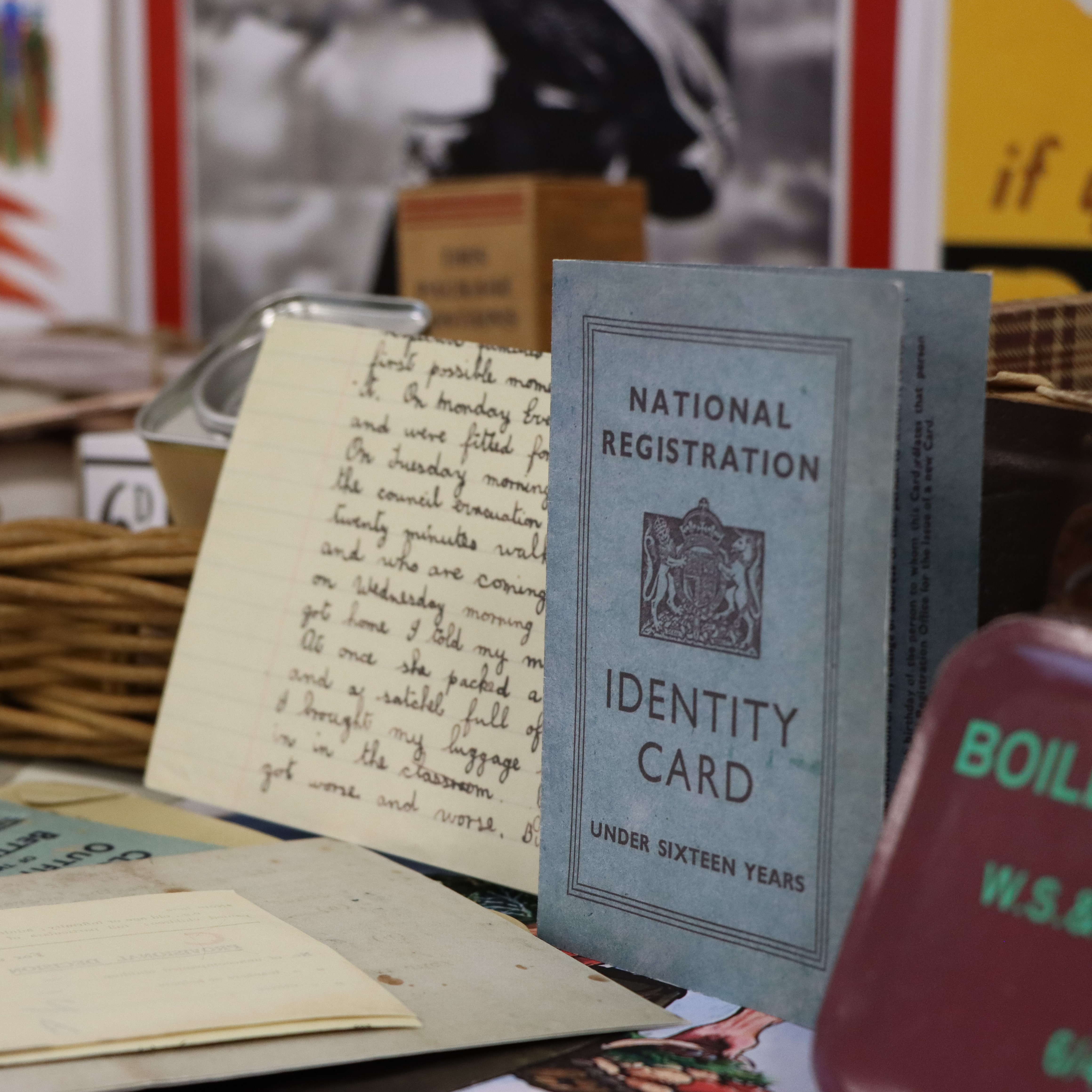 Image features an identity card, boiled sweets and a child's evacuation suitcase