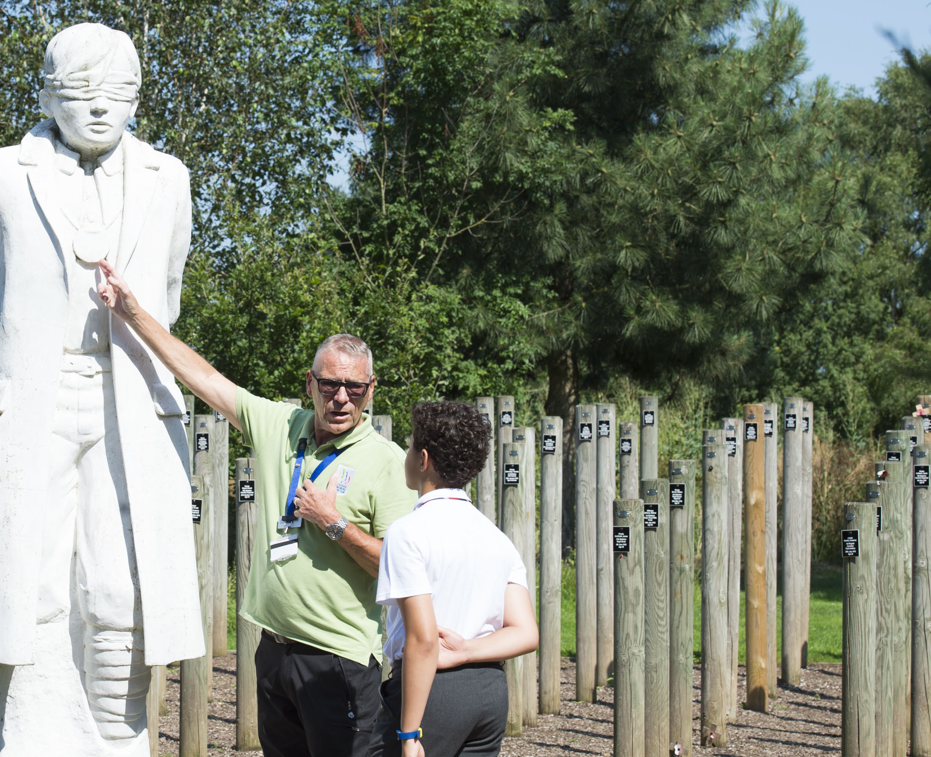 A young visitor learns about the Shot at Dawn memorial.